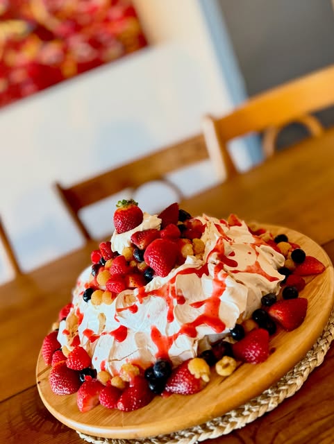 A homemade cake topped with berries